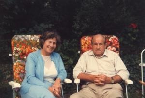 Mum and Doug in garden loungers