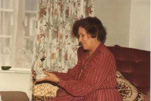 Mum inspects white chinese statuette, Hadley Wood
